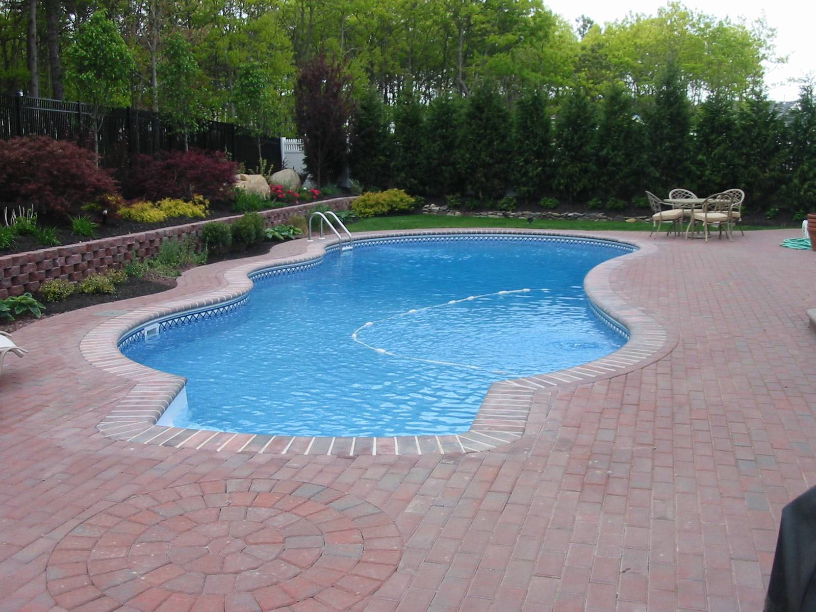 poolside water feature with slide, stairs and grotto